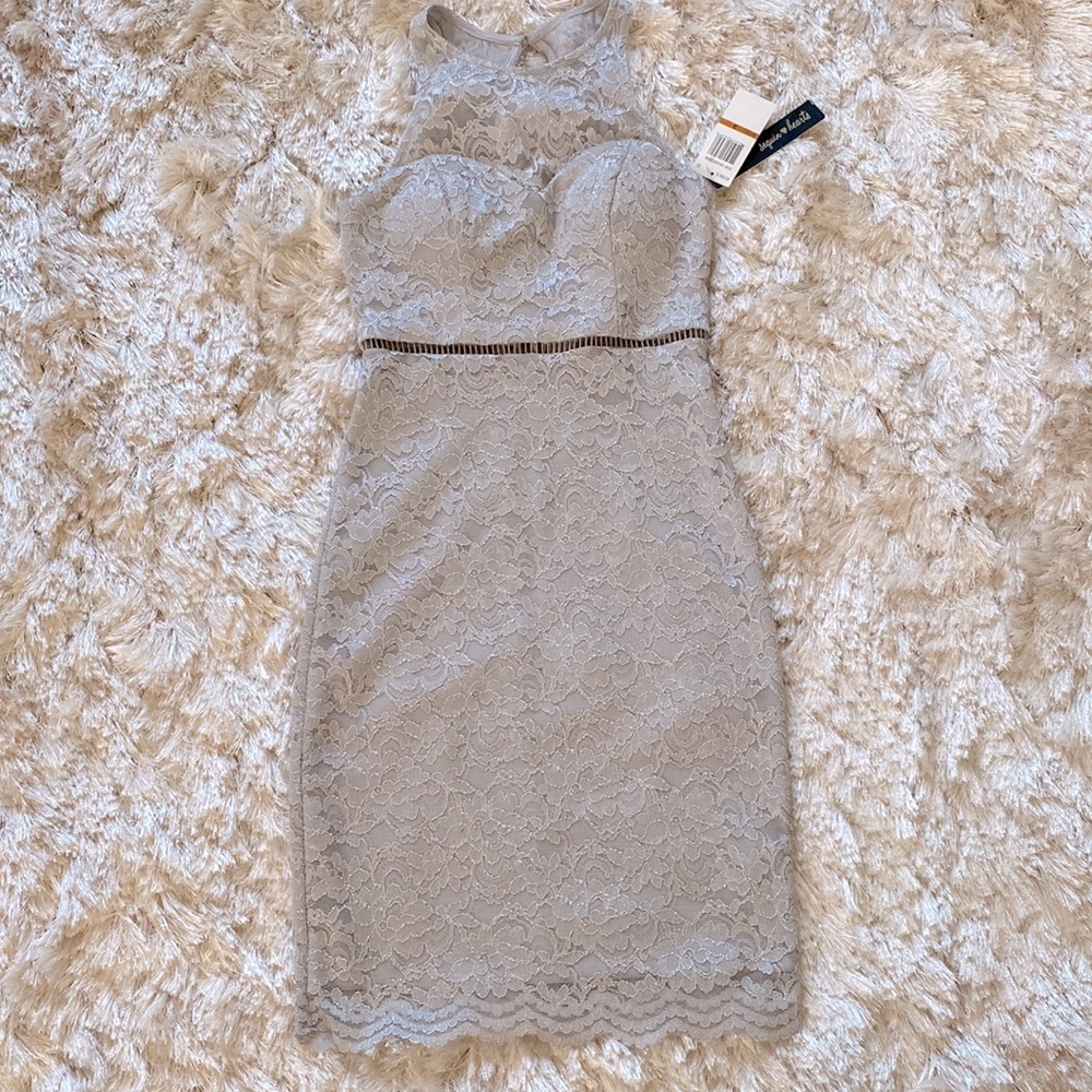 New. Silver lace. Built in cups. Zipper closure.